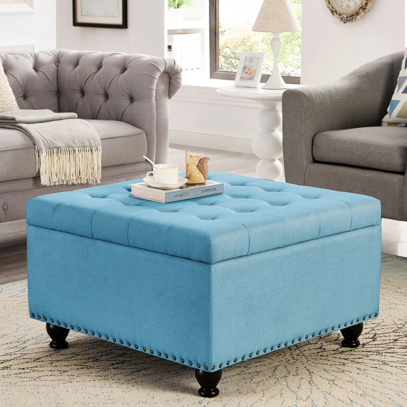 Rangement bleu avec capitonnage et pieds rembourrés