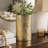 Titus Decorative Eye Vase, Sculpted Linear Wood Grain Gold Aluminum 10 Inch