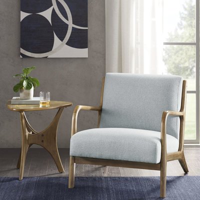 Chaise longue bleue rembourrée avec pieds en bois