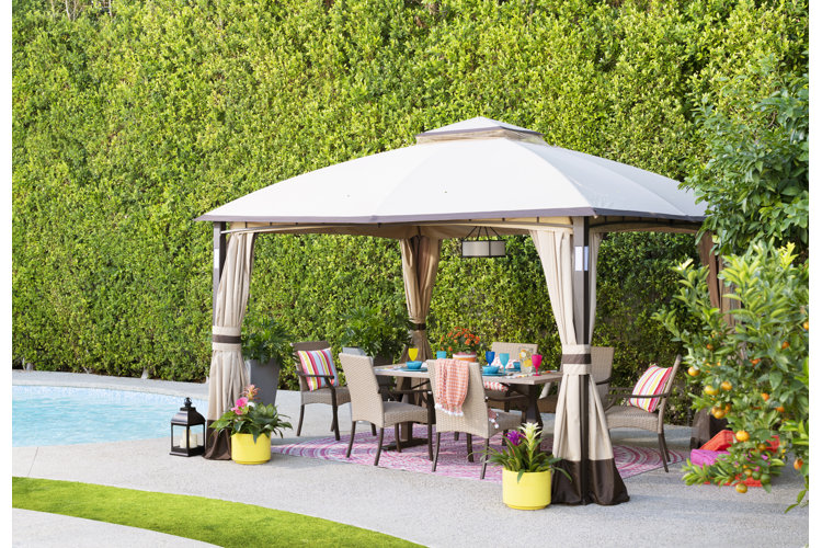 outdoor gazebo covering a modern patio furniture set