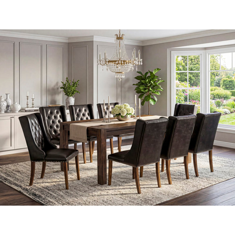 L'ensemble de table de cuisine 9 pièces comprend une table de salle à manger rectangulaire en bois rustique et 8 chaises Parson en similicuir noir