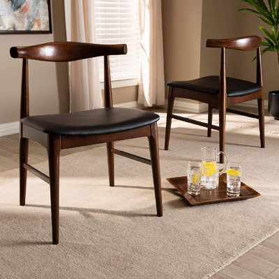 Southerland Solid Wood Ladder Back Dining Chair in Black by Ivy Bronx