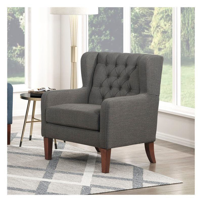 Fauteuil à oreilles classique avec dossier capitonné, revêtement gris foncé et pieds en bois massif