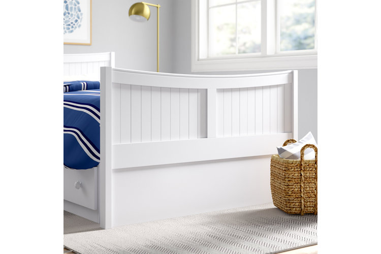white wood coastal bed frame with blue sheets