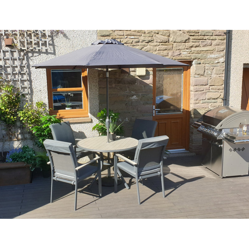 VanVleet 4 - Person Patio Dining Set with Round Table , Cushions Included
