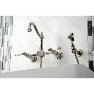 Kingston Brass Heritage Double-Handle 3-Hole Wall-Mount Bridge Kitchen Faucet with Brass Sprayer