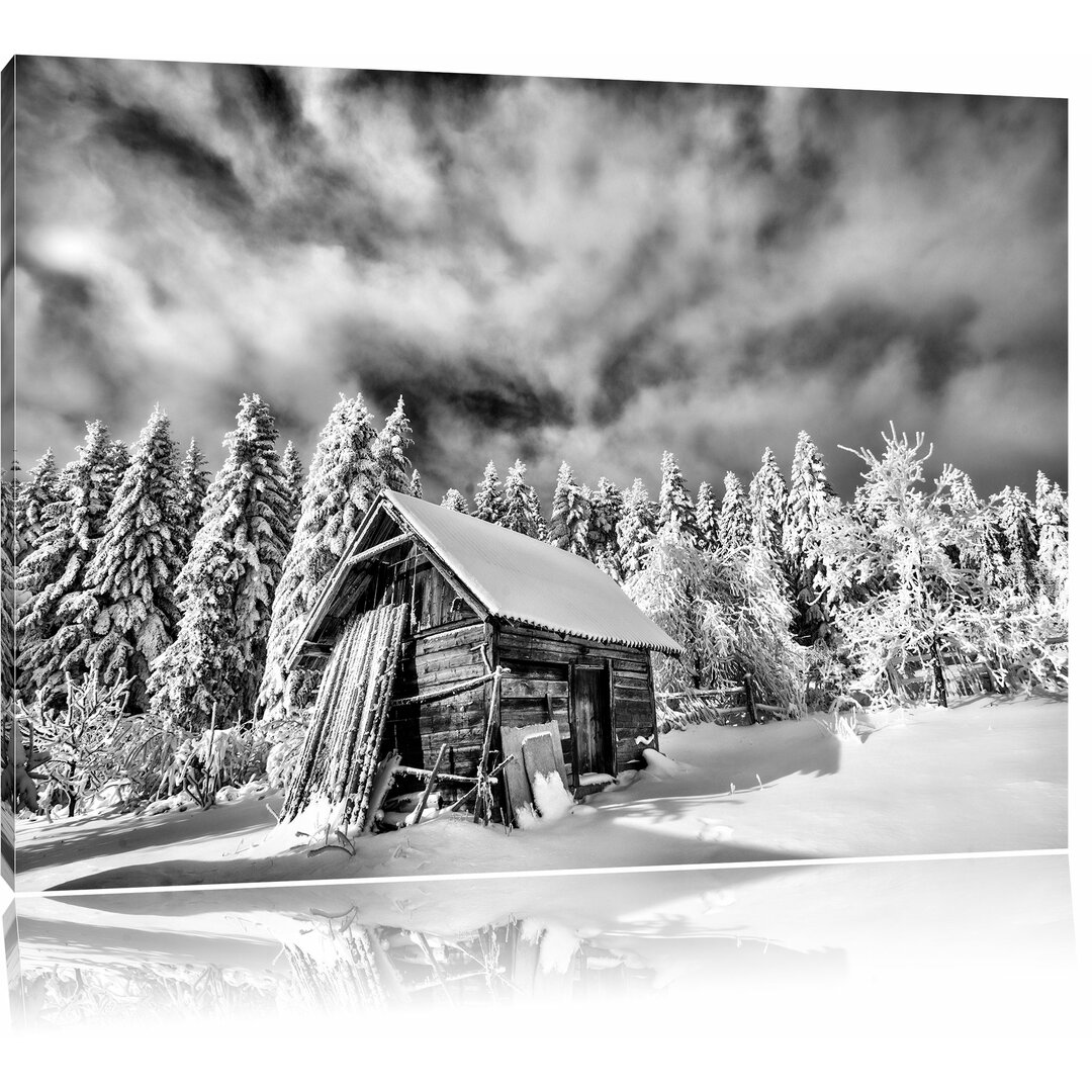 Leinwandbild Holzhütte im Schnee in Monochrom