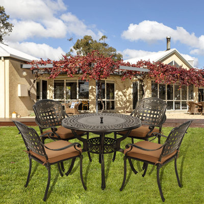 Newton 4 - Person Patio Dining Set with Round Table , Cushions Included