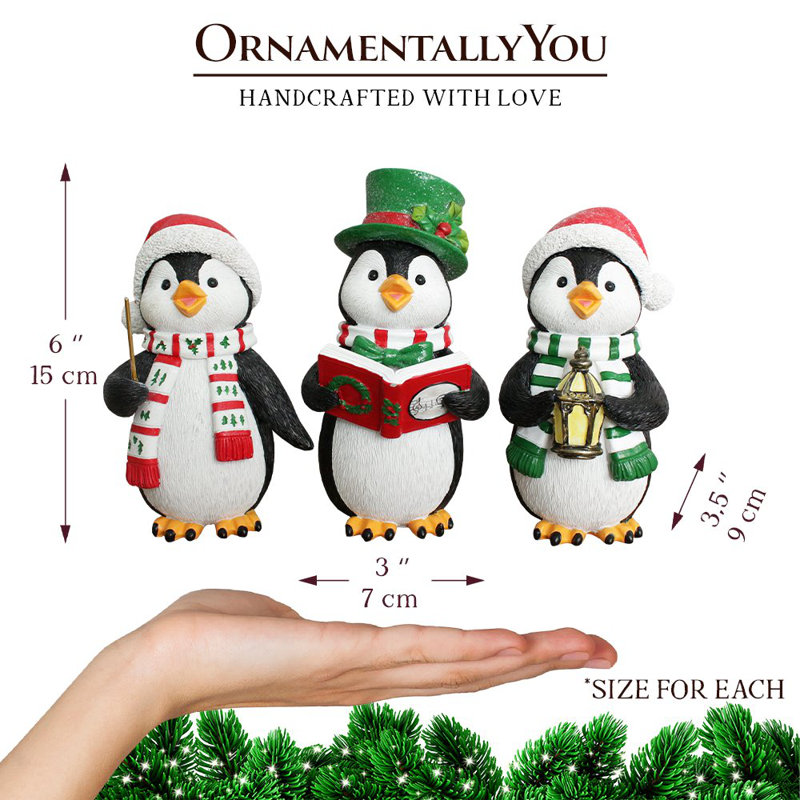 Ensemble de trois figurines de Noël en forme de pingouin caroling