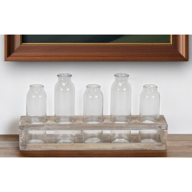 Ensemble de cinq bouteilles décoratives en verre transparent