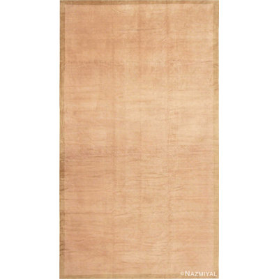 Tapis oriental antique et mauve doux