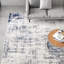 Tapis abstrait bleu / gris clair / blanc Magallanes-144949197