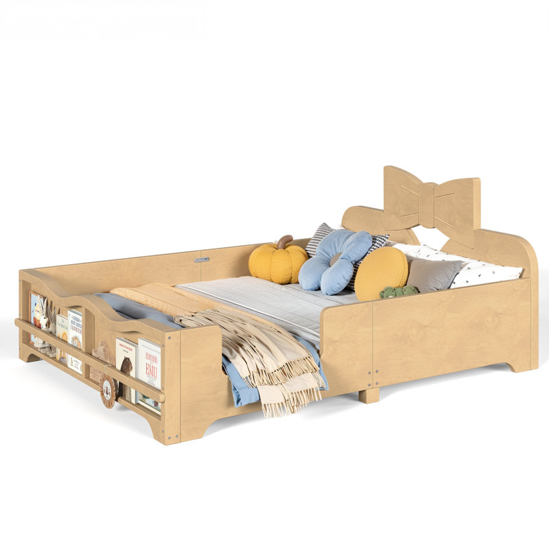 Lit plateforme pour enfants avec tête de lit à nœud papillon, barrières de sécurité intégrales et tablette latérale intégrée.