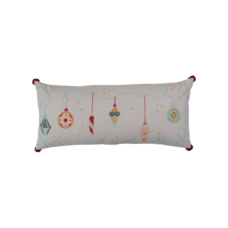 Coussin en coton avec broderies et pompons