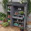 Abri de jardin extérieur avec trois portes, sept tablettes, deux tiroirs, six crochets et un poste de travail-132664368