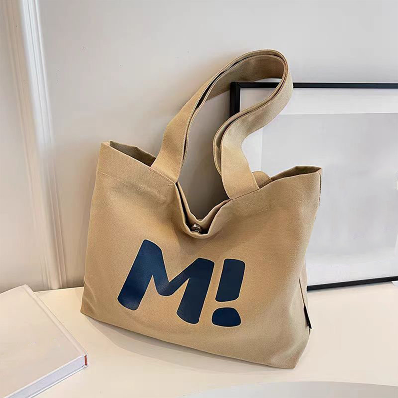 Sac à dos en toile Un sac à bandoulière polyvalent et de grande capacité, idéal pour le travail, la plage, les voyages et le magasinage