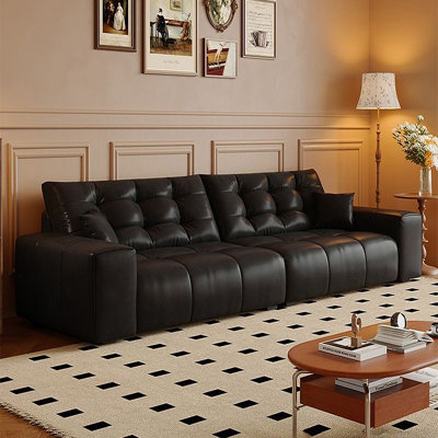 Canapé modulaire noir en similicuir