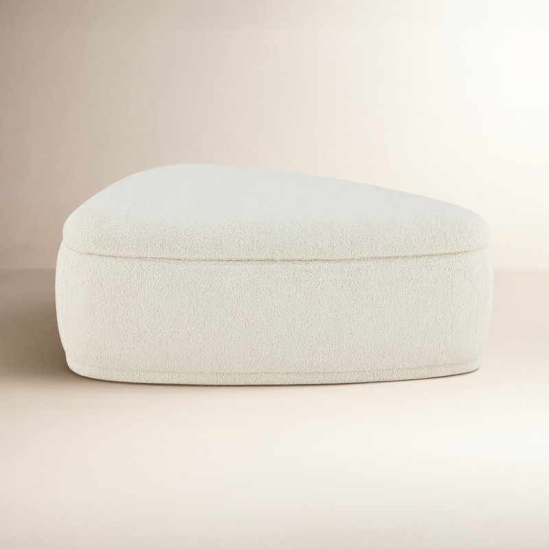 Adna 44'' Triangular Upholstered Storage Ottoman, Aries Cream Sherpa