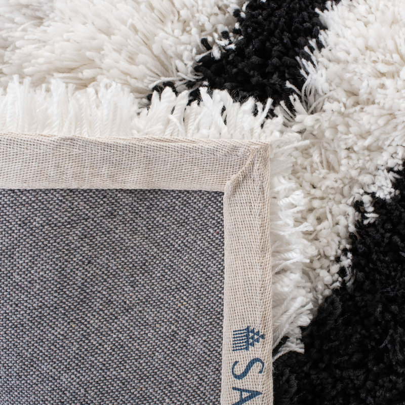 Delane Handmade Shag Black/White Area Rug, Rectangle 2'6" x 4'