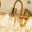 Luminaire pour meuble-lavabo en laiton antique à 3 lumières Kella, verre transparent Lotus, base E26, fixation murale pour salle de bain