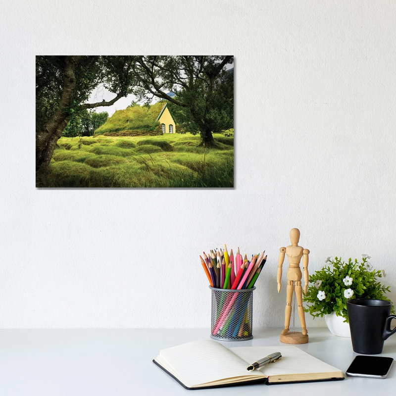 Iceland, Turf-Roofed Hof Church And Surrounding Grave Mounds. by Mark Williford - Wrapped Canvas Print