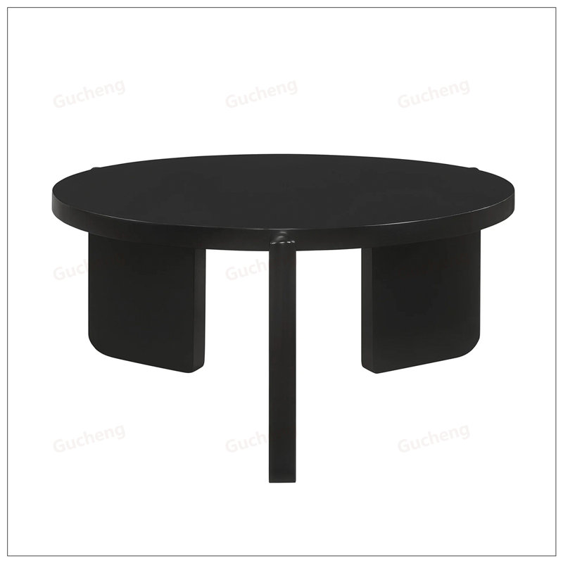 Table basse ronde en bois robuste avec une finition noire lisse et une conception unique des pieds pour les salons modernes