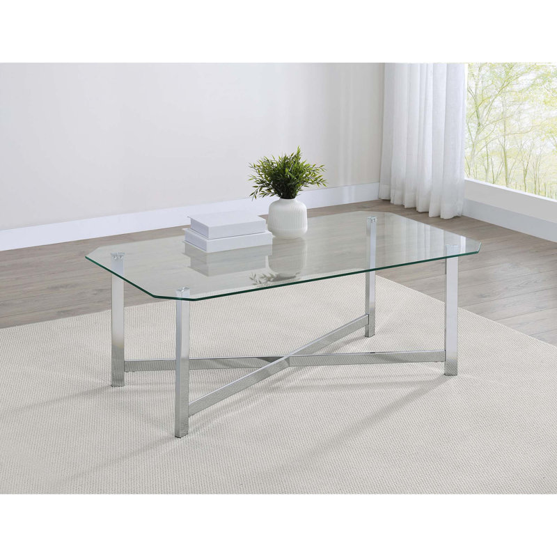 Table basse élégante en verre avec base ouverte en métal