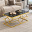 Table basse rectangulaire glamour dorée et en verre avec structure en métal pour salon