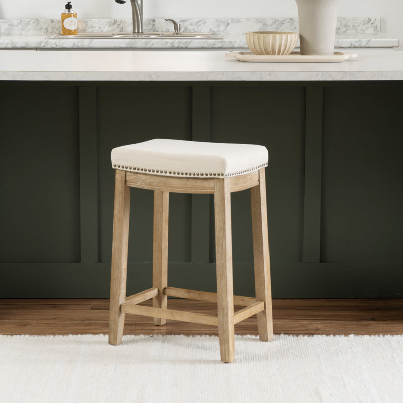 Tabouret en bois massif avec siège rembourré Bartonville, Cadre en polyester beige / Naturel