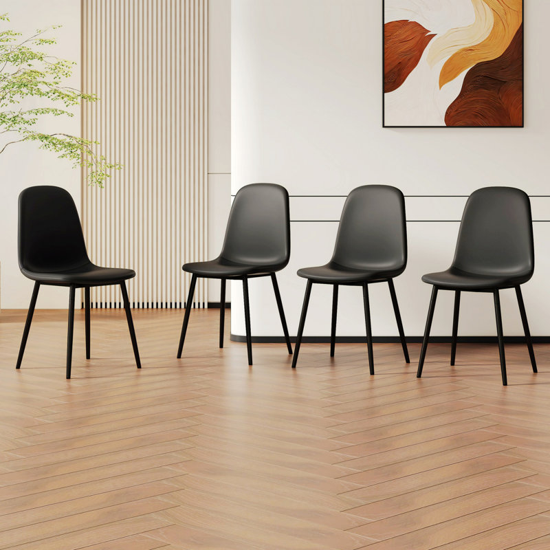 Quatre chaises de salle à manger rembourrées avec pieds en métal