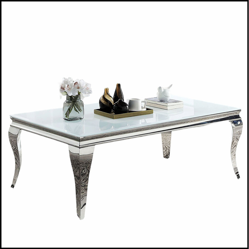 Table basse contemporaine avec plateau en verre blanc et structure en métal argenté, parfaite pour les salons modernes