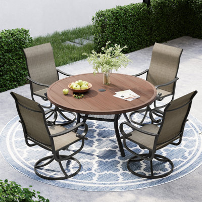 Ensemble repas pour 4 personnes avec table de salle à manger ronde et 4 chaises pivotantes en textilène