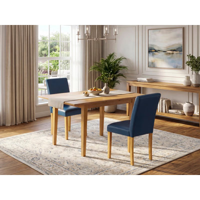 Ensemble table et chaises de cuisine 3 pièces comprenant une table à manger rectangulaire avec rallonge papillon et 2 chaises Parson en similicuir bleu oasis.