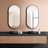 Stavya 36"H x 18"W Modern Minimalist Wall Mounted Oval Vanity Metal Mirror-556987484