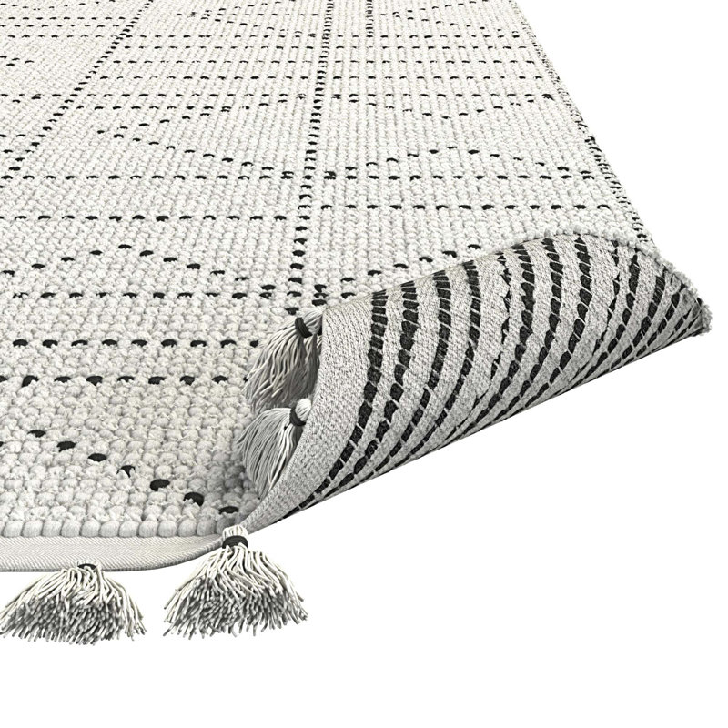 Tapis en laine et coton à pampilles