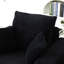 Fauteuil noir surdimensionné avec fauteuil d'appoint