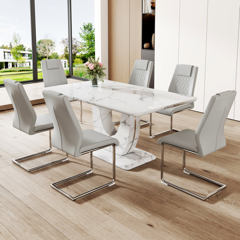Table à manger en marbre convenant aux restaurants - table de 63 po x 37 po avec 6 chaises en polyuréthane grises, plateau de table épais, sièges confortables, pieds en métal argenté et chaise, autocollant texturé blanc, base