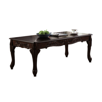 Dark Cherry Finish Wood Coffee Table With Ornate Details And A Contemporary Edge Elegant Accents For Classy Look