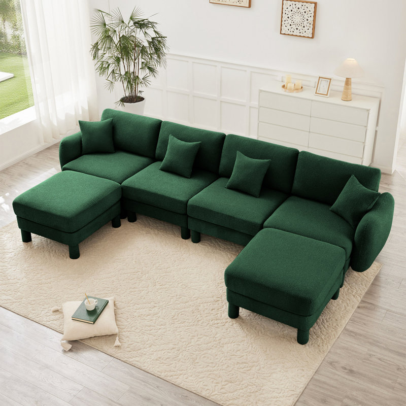 Canapé modulaire en tissu Boucle avec accoudoirs distinctifs et repose-pieds mobile