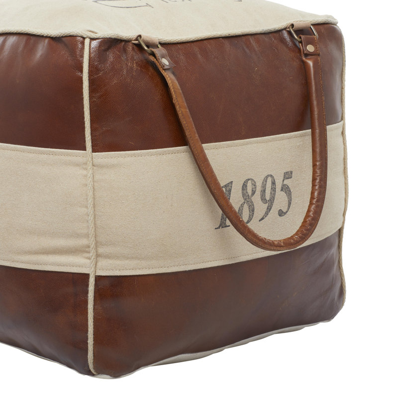 Pouf rembourré en toile brun avec détails en cuir