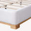 Base de lit grand format avec tête de lit courbée rembourrée Boucle, base en bois massif