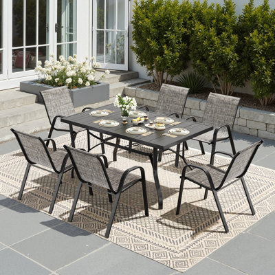 Ensemble de salle à manger de patio pour 6 personnes avec table rectangulaire de 60 pouces et 6 fauteuils empilables
