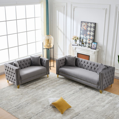 Canapé Chesterfield confortable en velours au design traditionnel et élégant, parfait pour le salon