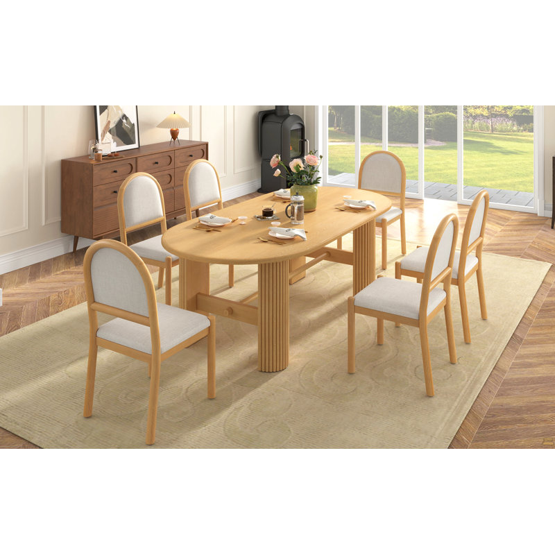 Ensemble de table à manger ovale 7 pièces pour 6 personnes, 180 cm L x 100 cm l x 76 cm H, avec 6 chaises de salle à manger rembourrées et un pied central en bois cannelé (naturel).