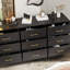 Commode 9 tiroirs moderne noir avec poignées et pieds dorés