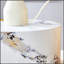 Table cylindrique polyvalente au design à motifs, idéale pour les espaces café, repas et travail, quel que soit le style d'intérieur.