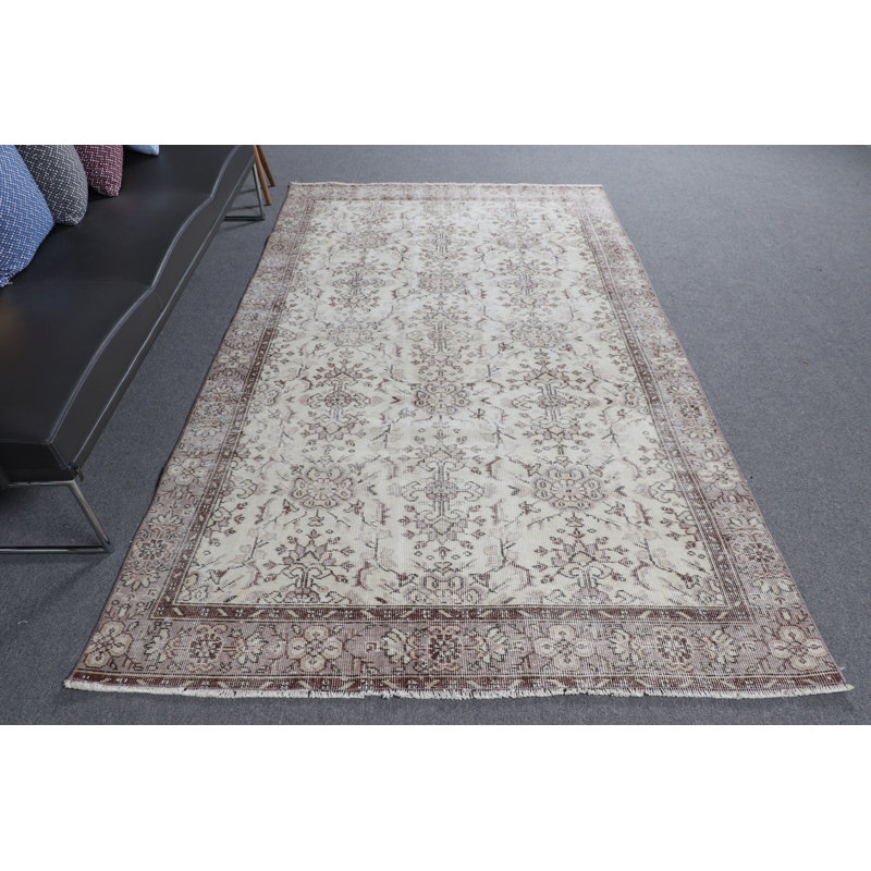 Classic Turkish Area Rug in Elegant Cream and Brown Creating An Atmosphere of Timeless Home Elegance with Unique Handmade Design and Oriental Pattern