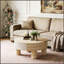 Table basse ronde avec plateau rabattable et rangement dissimulé, idéale pour un intérieur moderne et une organisation optimale de l'espace.