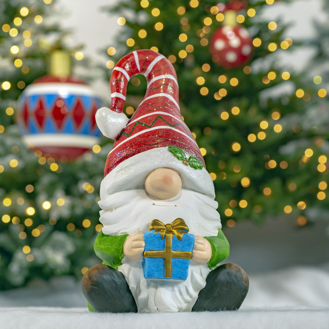 Christmas Garden Gnome Sitting with Gift and Red Striped Hat "The Goodfellows" The Holiday Aisle®