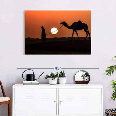 Silhouette d'homme et de chameau